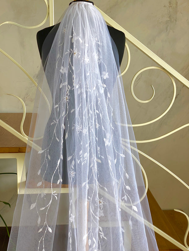 Wedding veil with delicate embroidery, twigs with flowers. Decorated with rhinestones and crystals, handmade.