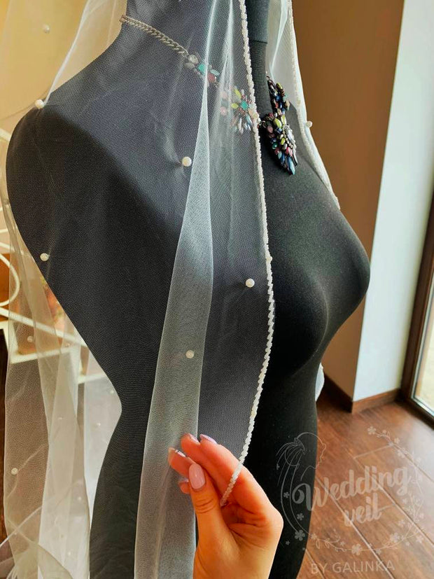 Personalized wedding veil with pearls.