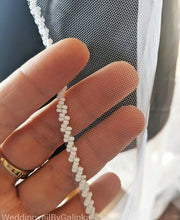 Personalized wedding veil with pearls.