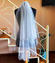 The veil is embroidered beads in two layers along the edge with beautiful ruffles.