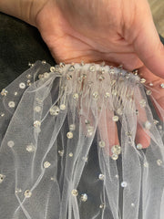 Wedding veil embroidered with beads, crystals, stones.