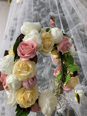 Wedding veil with a wreath and scattering flowers.