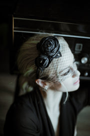 Hat veil on the headband decorated with roses and rhinestones