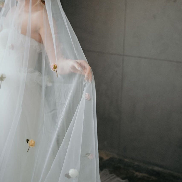 Wedding veil with a wreath and scattering flowers