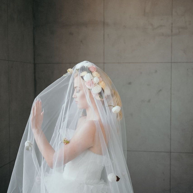 Wedding veil with a wreath and scattering flowers