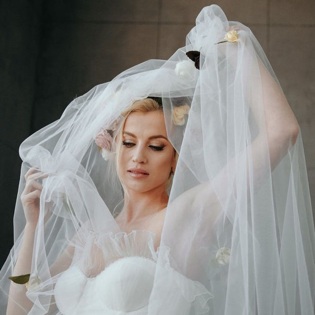 Wedding veil with a wreath and scattering flowers