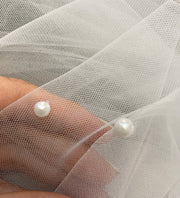 Wedding veil with a scattering of pearl. Pearls sewn from bottom to top.