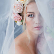 Wedding veil with a wreath and scattering flowers