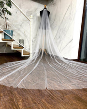 Wedding veil with a scattering of pearl. Pearls sewn from bottom to top.