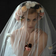 Wedding veil with a wreath and scattering flowers