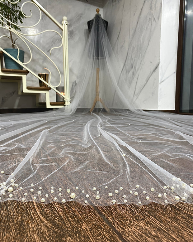 Wedding veil with a scattering of pears. Pearls border.