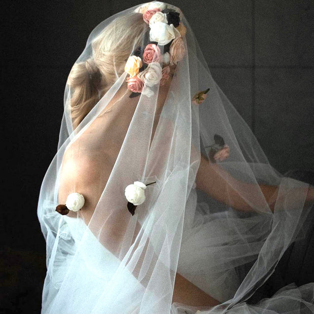 Wedding veil with a wreath and scattering flowers